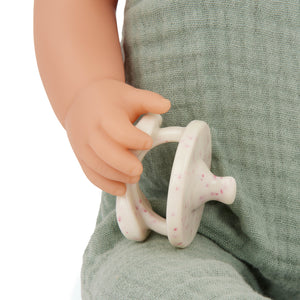 Babypuppe mit Schnuller im Musselinoutfit mit Stirnband