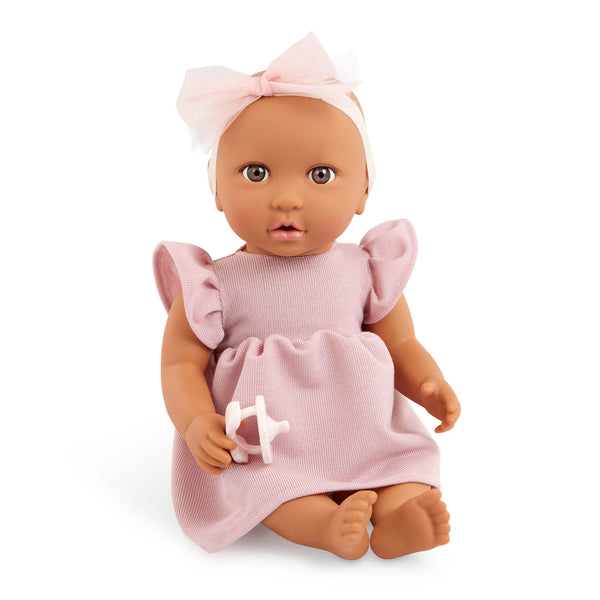 Babypuppe mit Schnuller im Kleid mit Stirnband