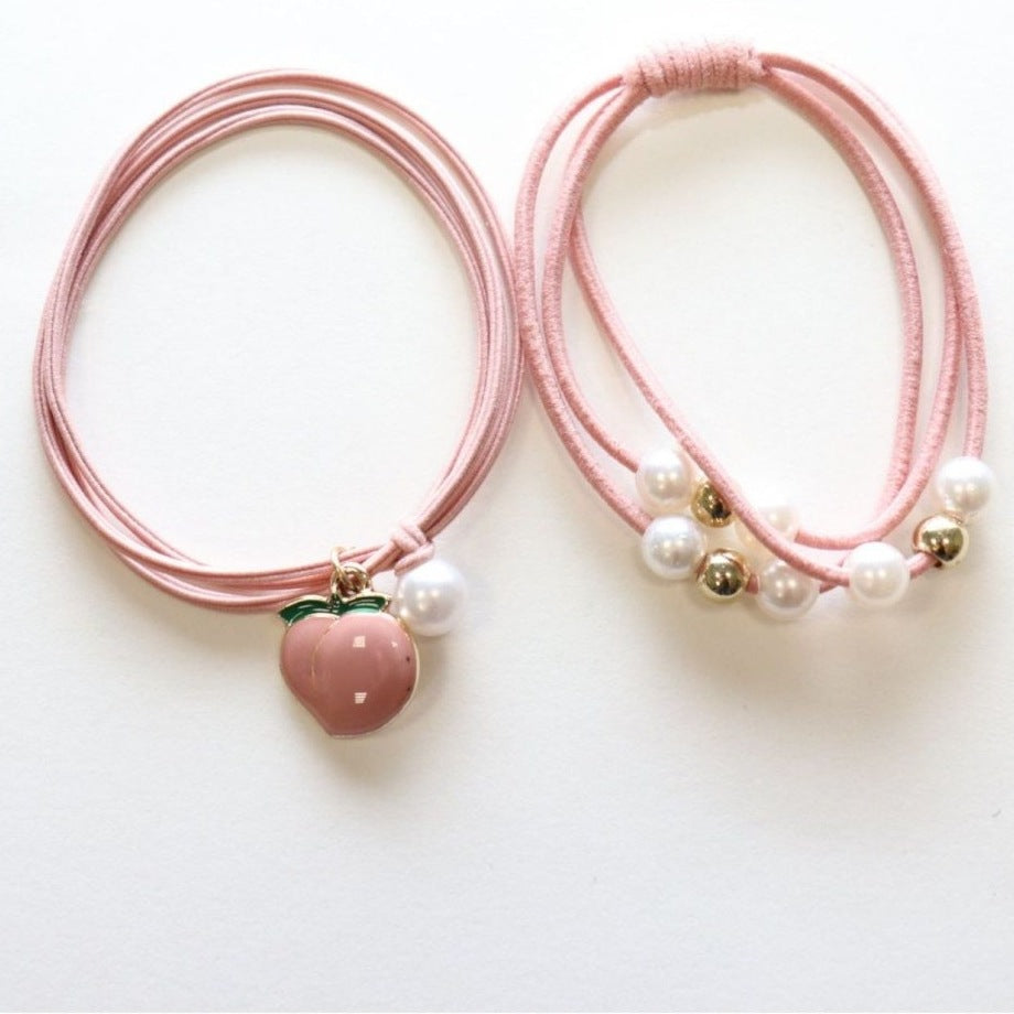 Yuko B. Haargummi-Armbänder Pfirsich - 2 Stück - Produktbild