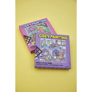 Zwei Cosy Painting Sets von Janod auf gelbem Hintergrund