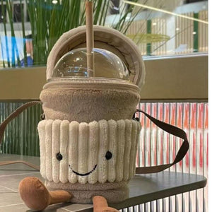 Geöffnete Jellycat Coffee-to-go-Tasche mit Reißverschluss auf einem Tisch