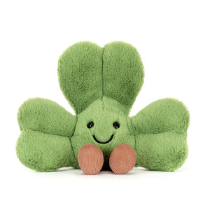 Jellycat Glücksklee Plüschspielzeug in Grün mit lächelndem Gesicht und schokoladenbraunen Beinen