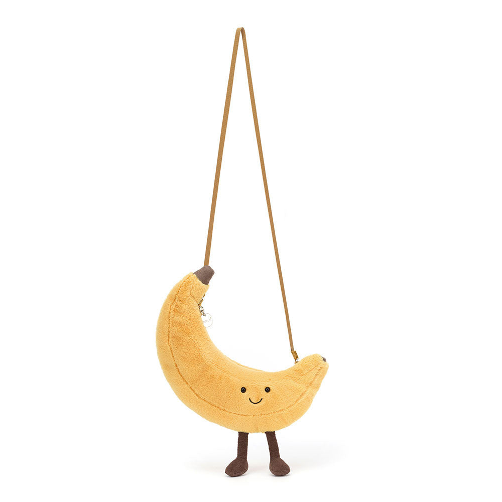 Jellycat Plüsch-Umhängetasche Fröhliche Banane 22 cm in Gelb mit Gesicht und braunen Füßen