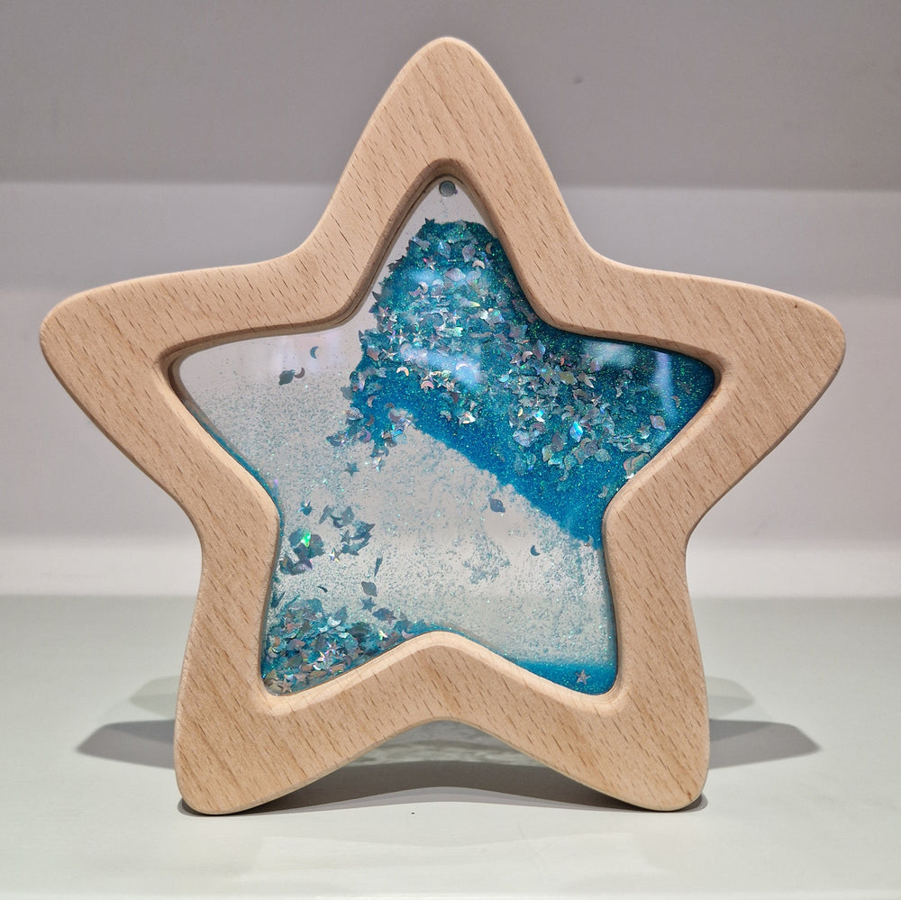 Sensorischer Stern leuchtet im Dunkeln mit buntem Glitzer und einer einzigartigen Form für spielerisches Lernen